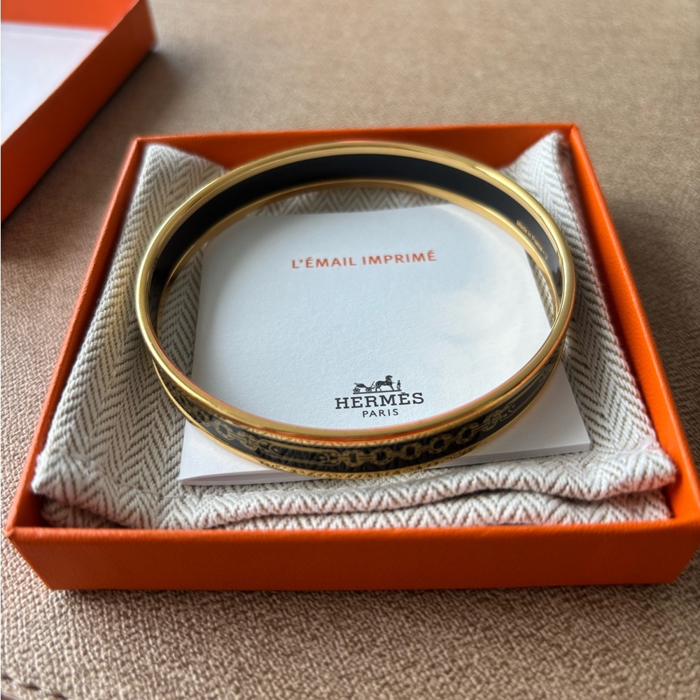 Hermès Gold and Black Bangle Bracelet